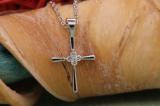 0.06 Carat (ctw) 10K White Gold Round White Diamond Ladies Cross Pendant (Gold Chain Included)