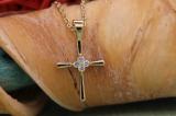 0.06 Carat (ctw) 10K Yellow Gold Round White Diamond Ladies Cross Pendant (Gold Chain Included)
