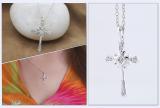 0.10 Carat (ctw) 10K White Gold Round White Diamond Cross Pendant 1/10 CT (Silver Chain Included)