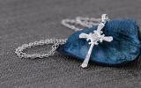 0.10 Carat (ctw) 14K White Gold Round White Diamond Cross Pendant 1/10 CT (Silver Chain Included)