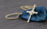 0.10 Carat (ctw) 10K Yellow Gold Round White Diamond Cross Pendant 1/10 CT (Gold Chain Included)