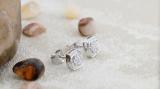 0.05 Carat (ctw) Round White Diamond Ladies Cushion Frame Knot Stud Earrings Sterling Silver