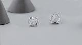 0.05 Carat (ctw) Round White Diamond Ladies Cushion Frame Knot Stud Earrings Sterling Silver