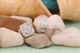 0.05 Carat (ctw) Round White Diamond Ladies Cushion Frame Knot Stud Earrings Sterling Silver
