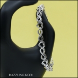 0.20 Carat (ctw) Round White Diamond Ladies Infinity Heart Tennis Bracelet 1/5 CT Sterling Silver