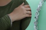 0.50 Carat (ctw) Round & Baguette Diamond Ladies Infinity Tennis Bracelet 1/2 CT Sterling Silver