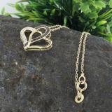 0.04 Carat (ctw) Round Black & White Diamond Ladies Double Heart Pendant 18K Yellow Gold