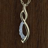 0.08 Carat (ctw) Round White Diamond Ladies Flame Shape Pendant 14K Yellow Gold