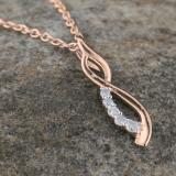0.08 Carat (ctw) Round White Diamond Ladies Flame Shape Pendant 18K Rose Gold