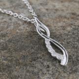 0.08 Carat (ctw) Round White Diamond Ladies Flame Shape Pendant Sterling Silver