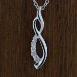 0.08 Carat (ctw) Round White Diamond Ladies Flame Shape Pendant Sterling Silver