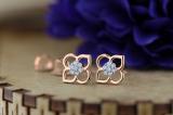 0.06 Carat (ctw) Round White Diamond Ladies Flower Shape Stud Earrings 18K Rose Gold