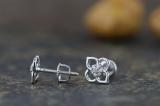 0.06 Carat (ctw) Round White Diamond Ladies Flower Shape Stud Earrings Sterling Silver