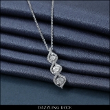 0.05 Carat (ctw) Round White Diamond 3 Stone Swirl Infinity Pendant in 925 Sterling Silver