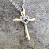 0.05 Carat (ctw) Round White Diamond Ladies Heart with Cross Pendant 18K Yellow Gold