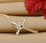 0.05 Carat (ctw) Round White Diamond Ladies Heart with Cross Pendant 18K Yellow Gold