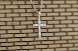 0.25 Carat (ctw) Round & Baguette Diamond Ladies Cross Religious Pendant 1/4 CT, 10K Yellow Gold