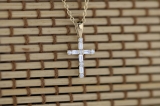 0.25 Carat (ctw) Round & Baguette Diamond Ladies Cross Religious Pendant 1/4 CT, 10K Yellow Gold