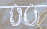 Ladies Round White Accents Diamond Infinity Crossover Huggies Hoops Earrings | 925 Sterling Silver