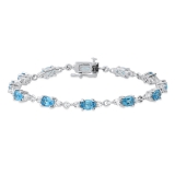 6X4 mm Oval Blue Topaz & 2.3 mm Round White Topaz Ladies Three Stone Bracelet Sterling Silver