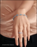 6X4 mm Oval Blue Topaz & 2.3 mm Round White Topaz Ladies Three Stone Bracelet Sterling Silver