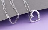 0.15 Carat (ctw) 14k White Gold 3 Stone Diamond Heart Pendant
