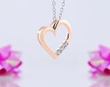 0.15 Carat (ctw) 18k Rose Gold 3 Stone Diamond Heart Pendant