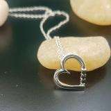 0.15 Carat (ctw) 10k White Gold Round Black Diamond Ladies Heart Pendant