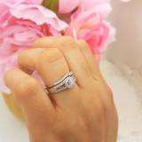 0.50 Carat (ctw) 10K White Gold Round Baguette Diamond Ladies Swirl Engagement Matching Band Halo Style Bridal Ring Set